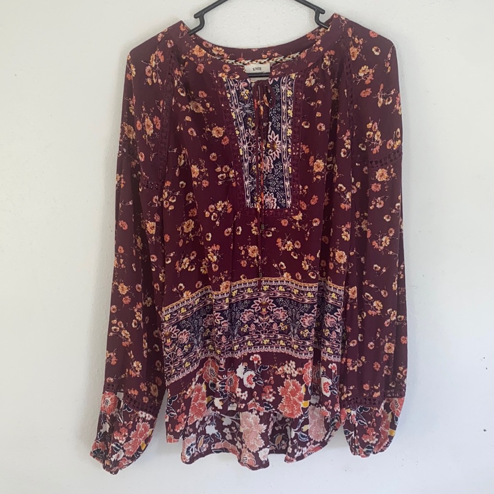Beautiful floral blouse. Lots of details.
